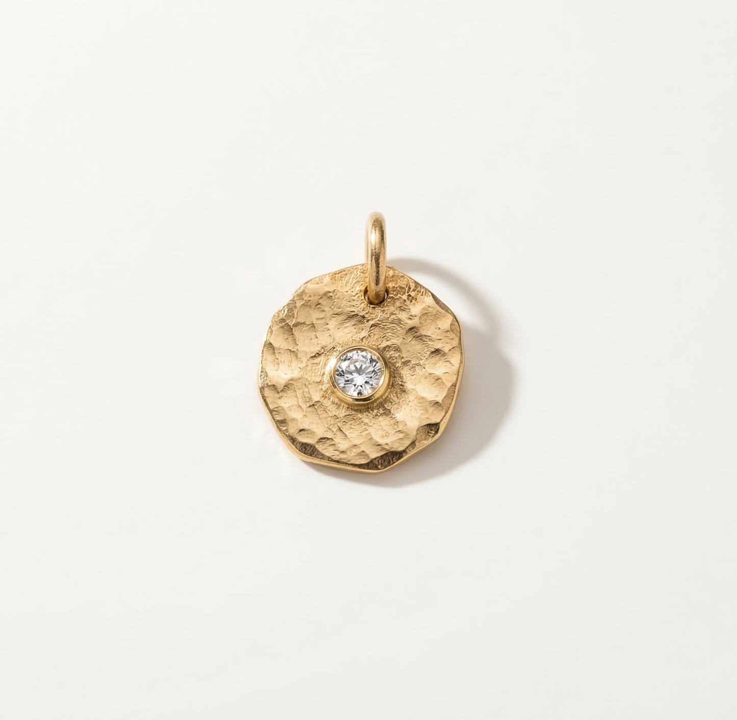 coin charm with zircon stone