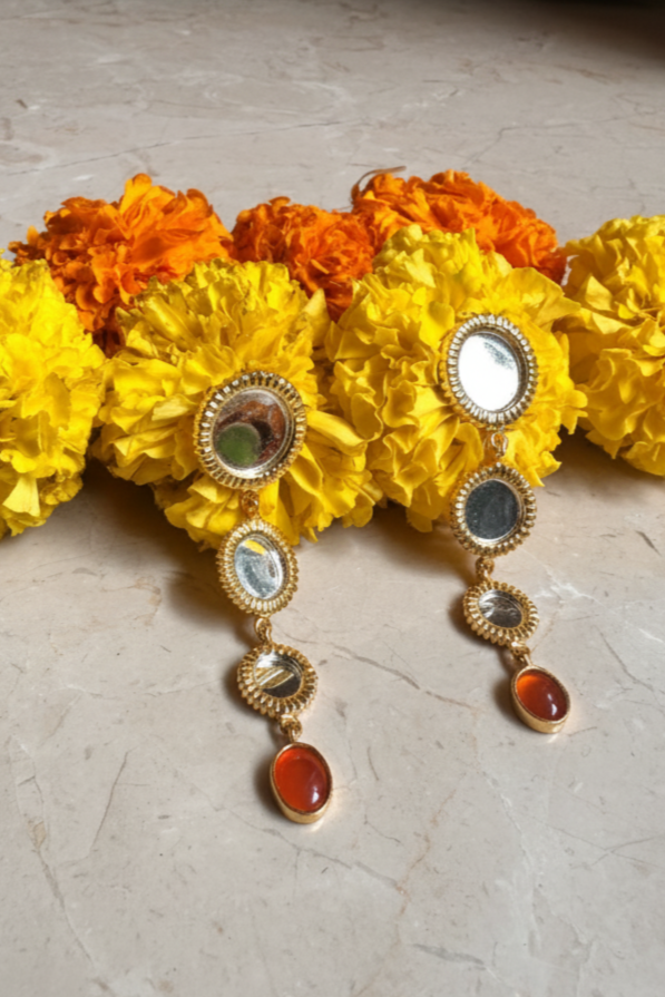 Decorative headband with flowers and colorful stones on a light surface