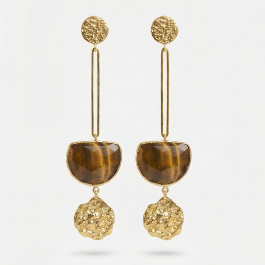 Pair of gold earrings with tiger's eye stones on a light gray background