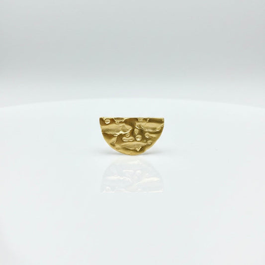 Gold brooch on a white background