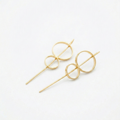 Gold 8 stick hoop earrings on a white background