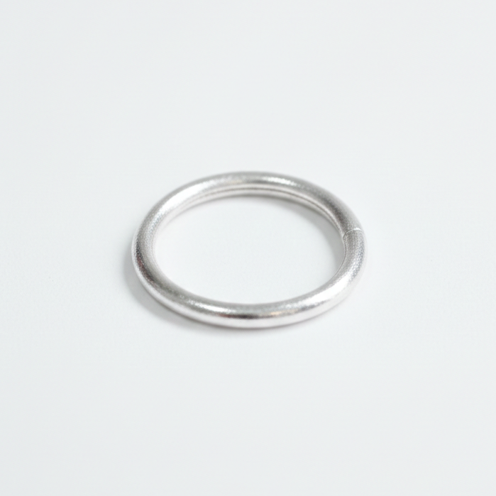 Silver bangle on a white background