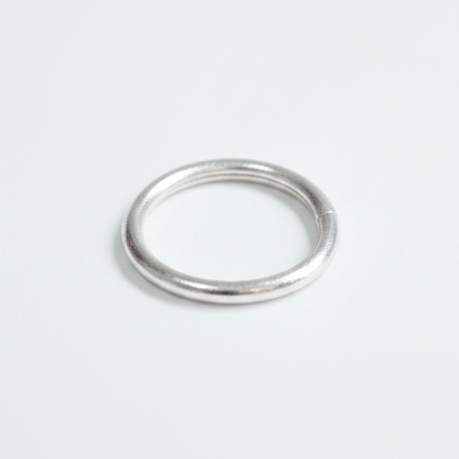 Silver bangle on a white background