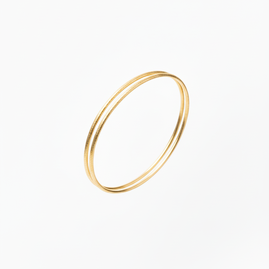 Gold bangle on a white background