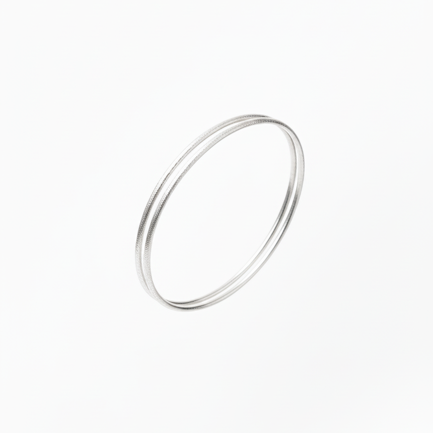 Silver bangles on a white background
