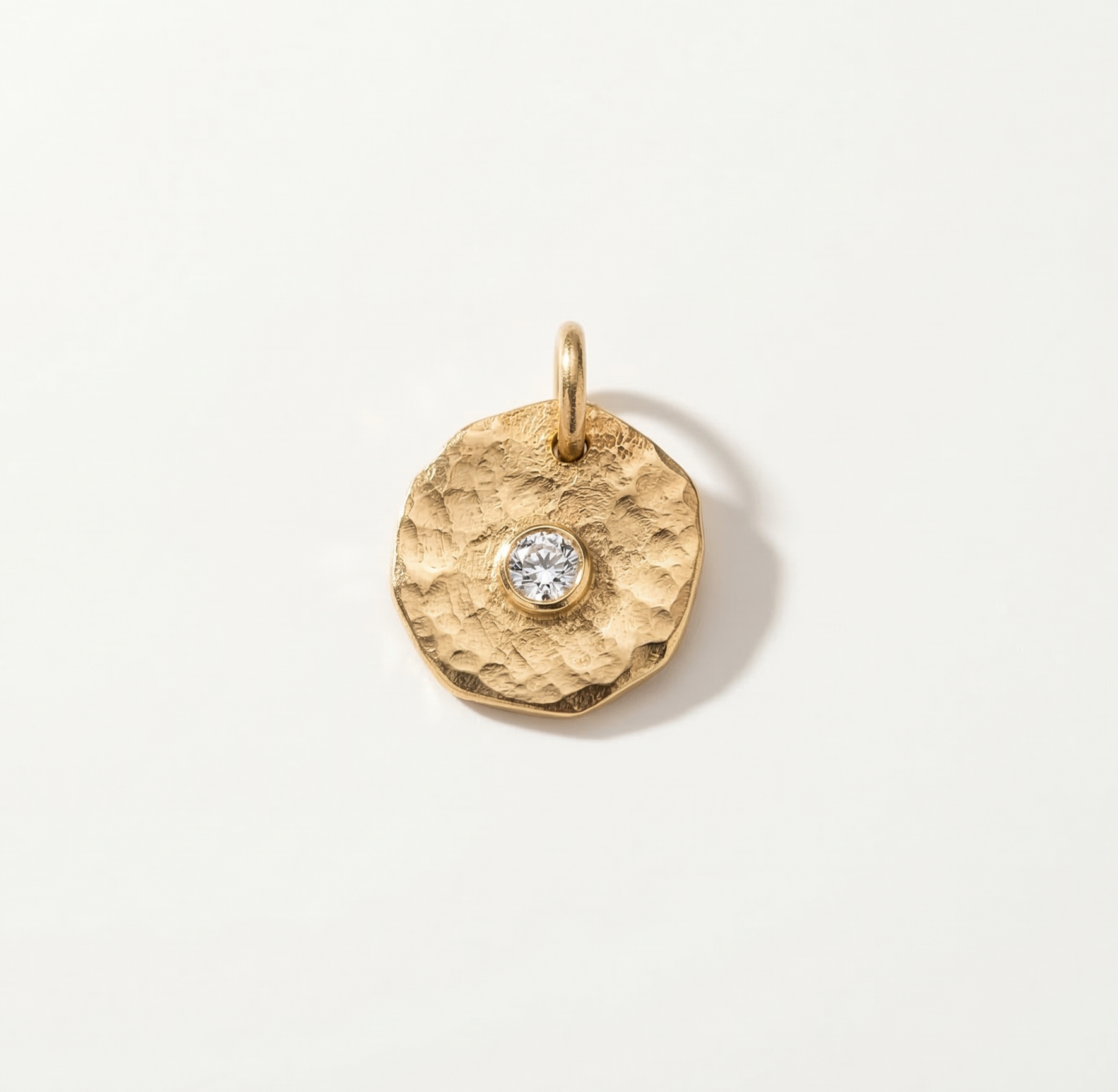 coin charm with zircon stone