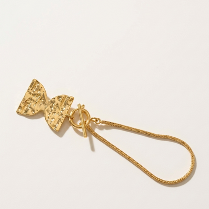 Gold bag charm
