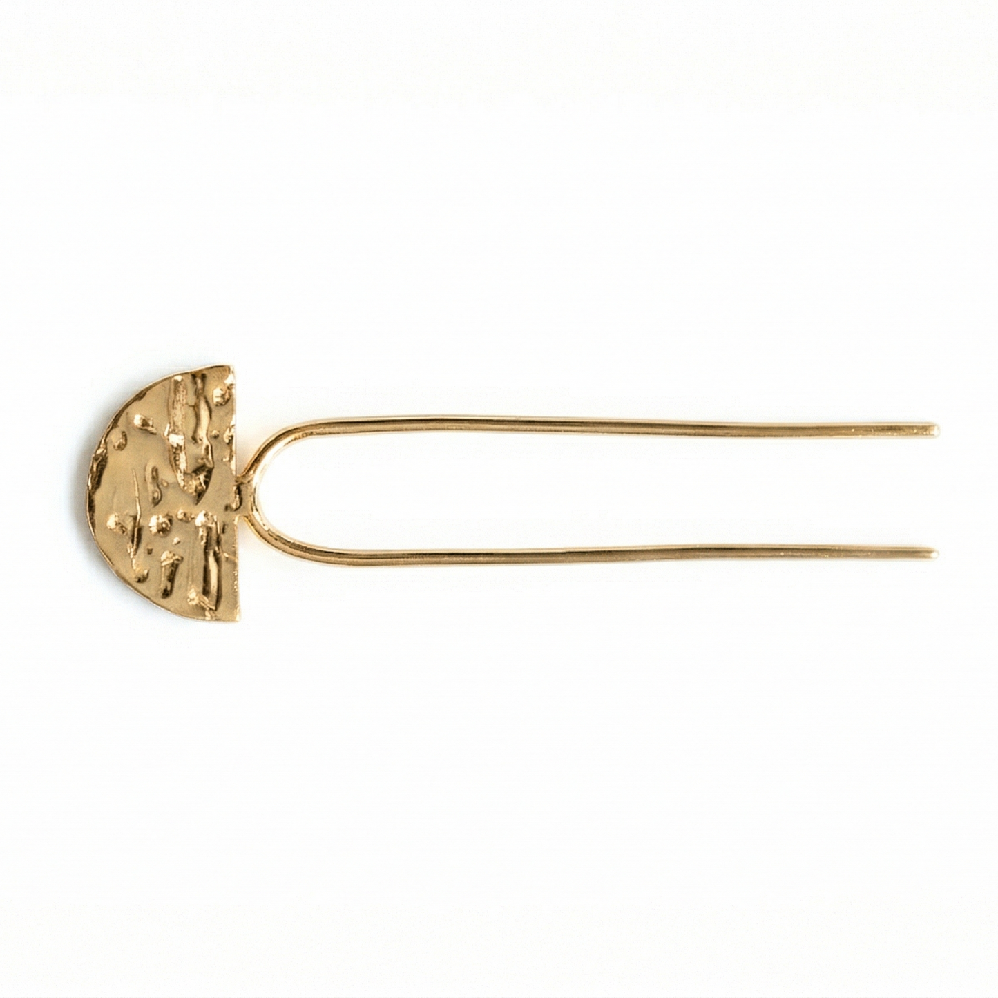 Gold hairpin with textured half-circle design on a white background