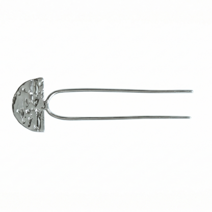 Silver hairpin with a decorative half-circle design on a white background