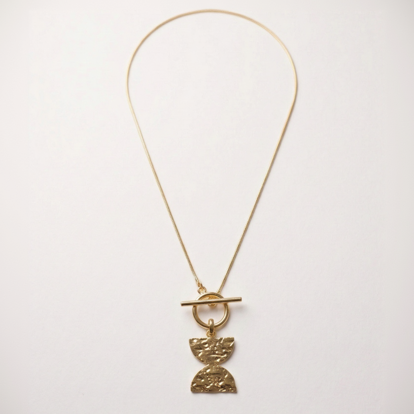 Gold necklace with a Double D pendant on a white background