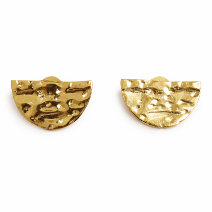 Pair of gold earrings on a white background