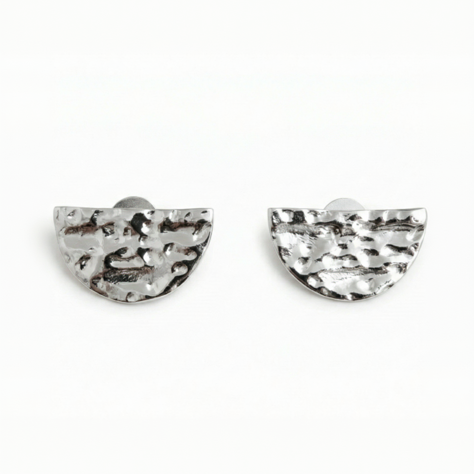 Pair of silver half-circle earrings on a white background