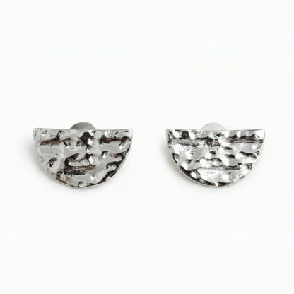 Pair of silver half-circle earrings on a white background