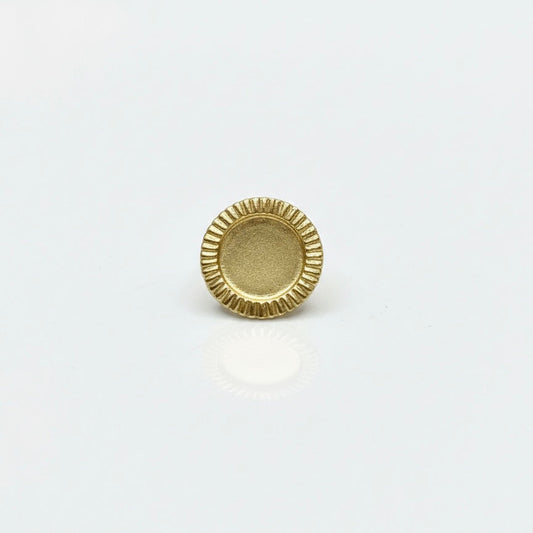 Gold coin brooch on a white background