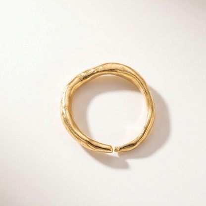 Gold ring on a white background