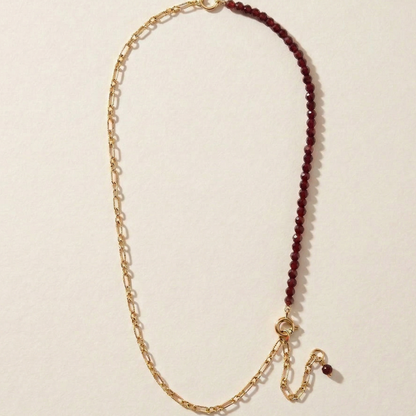 Necklace with gold chain and garnet semi precious stones
