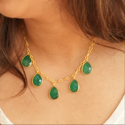Woman wearing green onyx necklace