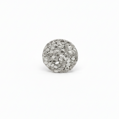 Silver ring charm on a white background