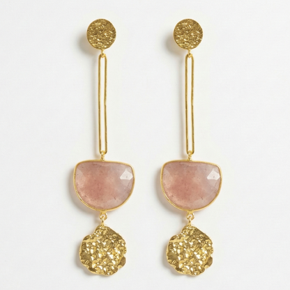 Gold and strawberry pink quartz earrings on a white background
